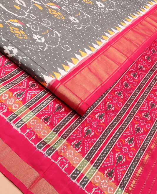 Grey Ikkat Silk Saree Decked Up with Elephant Motifs in Ikkat Weave, Complemented by a Contrast Temple Border, Pallu Woven in Intricate Ikkat Designs, and a Contrast Blouse