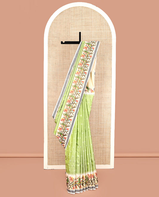 Green Pochampally Ikat Silk Saree, Steeped with Ikkat Buttas on Its Body, Complemented by a Contrast Temple Border of Paithani-Style Floral-Peacock Designs, Pallu of Same Design, and Paired with a Contrast Blouse