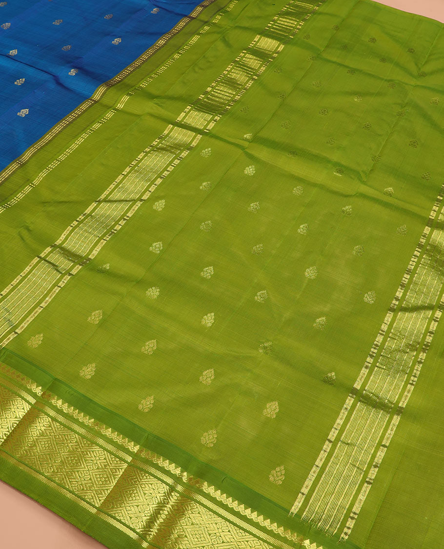 Blue zari buttas kanchipuram silk saree, contrast korvai border of thilakam mokku, banaras, and jaal designs, and zari design pallu