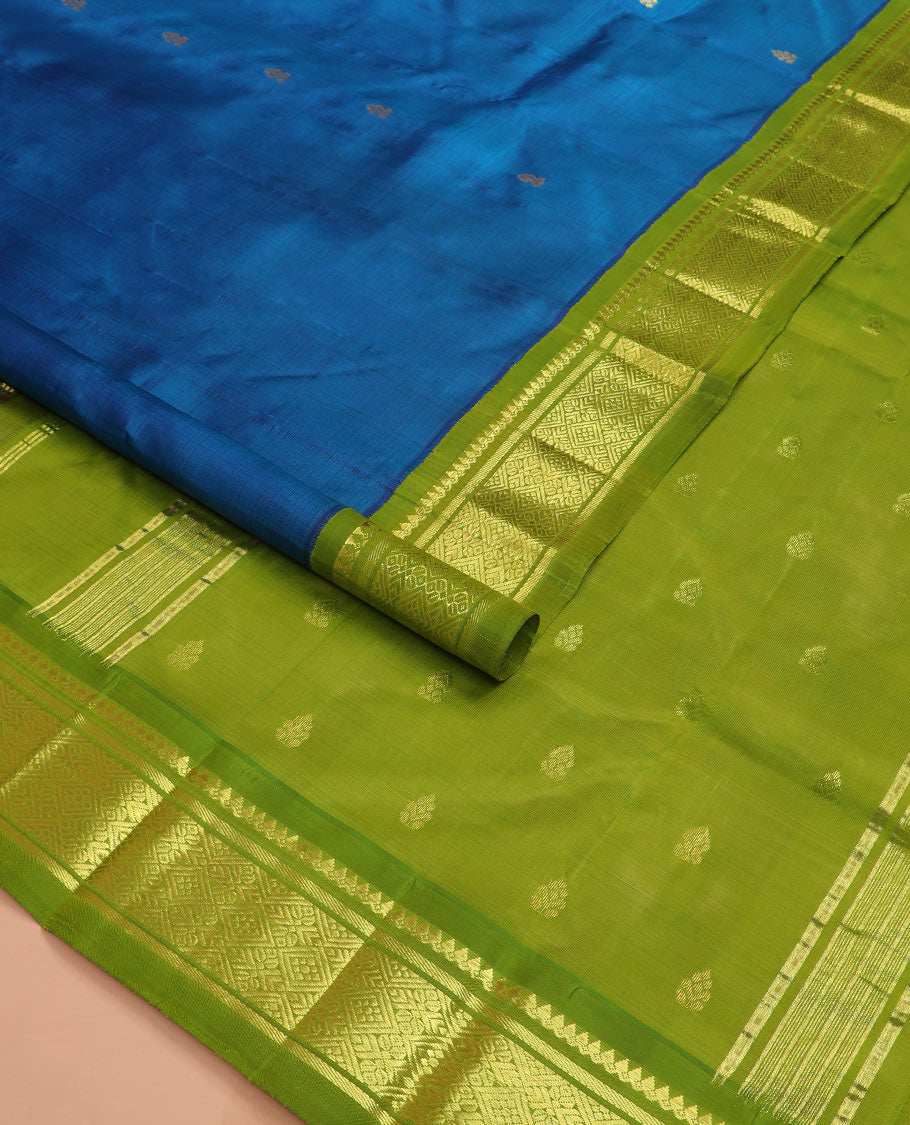 Blue zari buttas kanchipuram silk saree, contrast korvai border of thilakam mokku, banaras, and jaal designs, and zari design pallu
