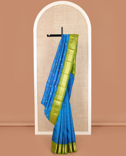 Blue zari buttas kanchipuram silk saree, contrast korvai border of thilakam mokku, banaras, and jaal designs, and zari design pallu