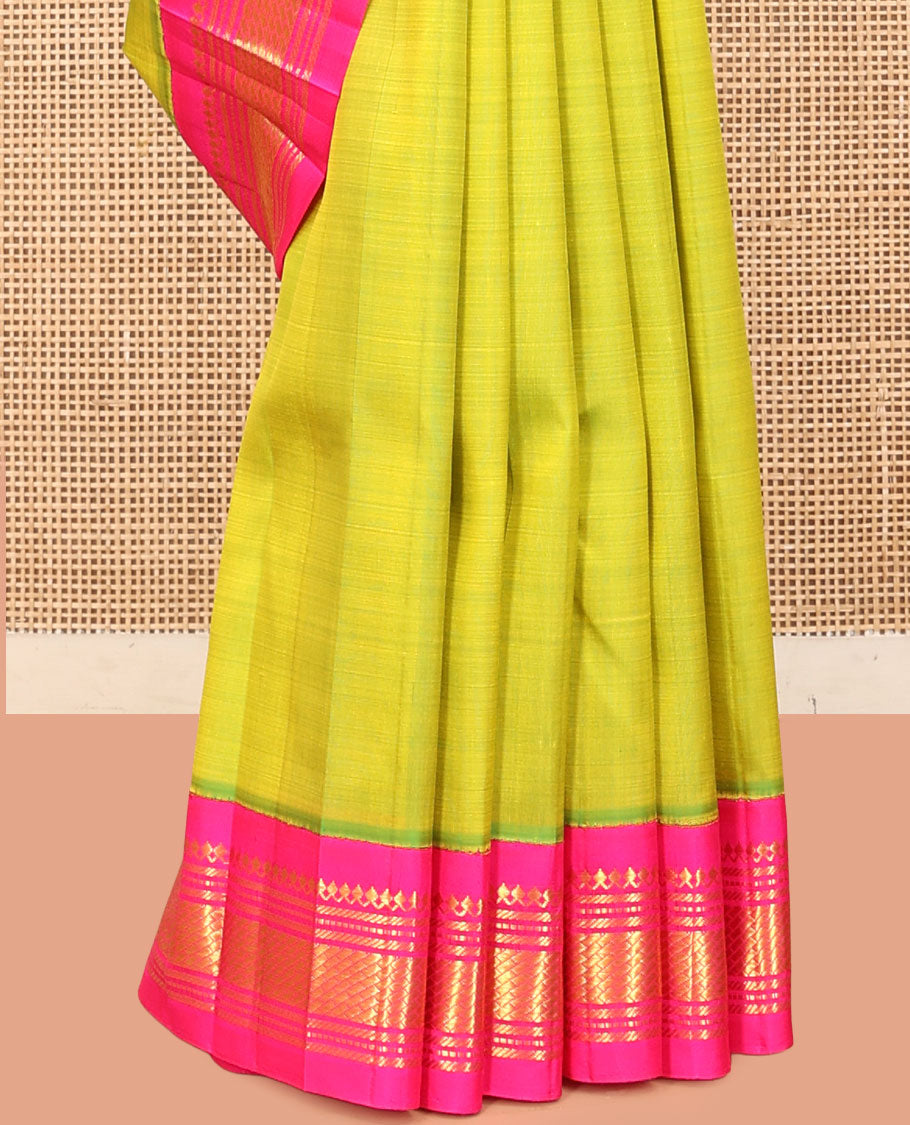 Green Kanchipuram Silk Saree, Woven with Zari Buttas, a Contrast One-Sided Korvai Border of Salngai, and Banaras Designs, a Zari Design Pallu, and No Blouse