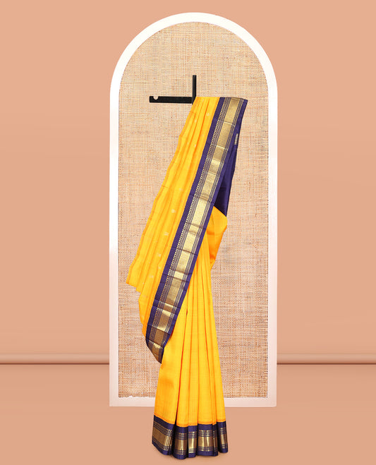 Orange Kanchipuram Silk Saree, Woven with Zari Buttas, Complemented by a Contrast Korvai Border of Panner Sombu, Banaras, Muthu, and Mayil Kann Design, Pallu of Zari Design, and No Blouse