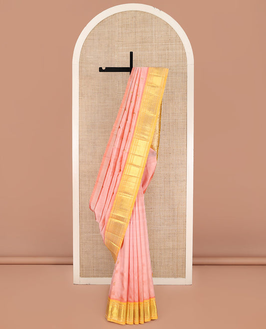 Pink Kanchipuram Silk Saree, Gleamed Up with Zari Buttas on Its Body, Complemented by a Contrast One-Sided Border of Panner Sombu, Banaras, and Jaal Designs, Pallu Features Floral Designs, and Comes Without a Blouse