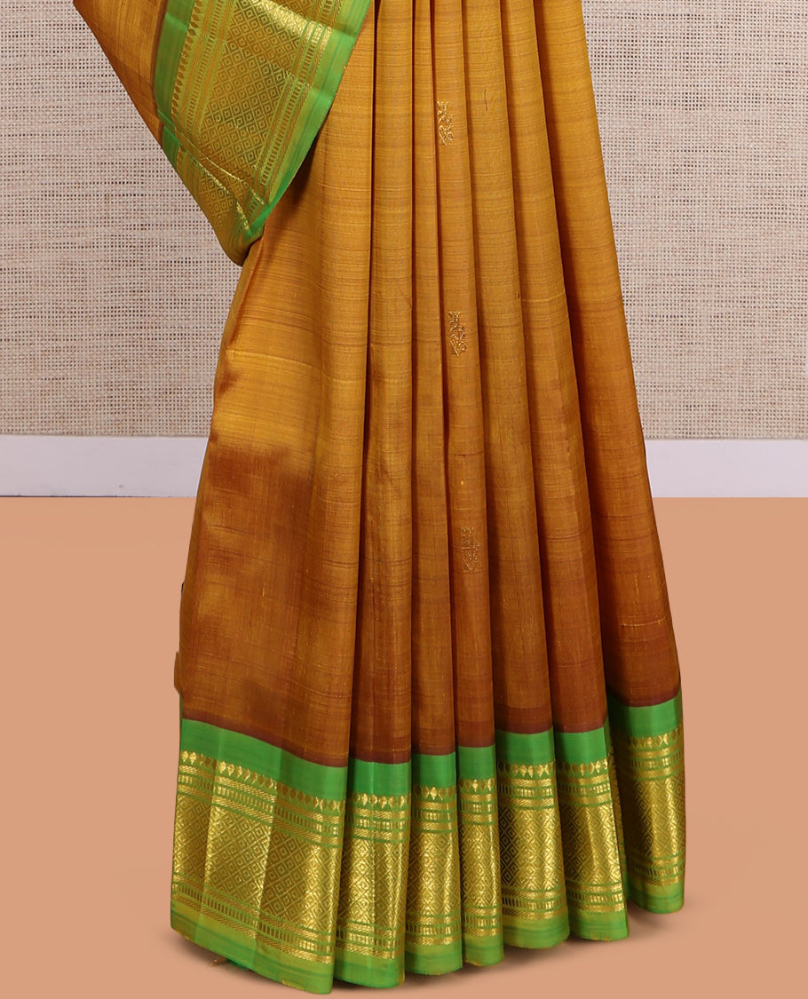 Mustard Kanchipuram Silk Saree, Elevated with Zari Buttas, a Contrast One-Sided Border of Rekku, Banaras, Muthu, and Mayil Design, Zari Design Pallu, and No Blouse