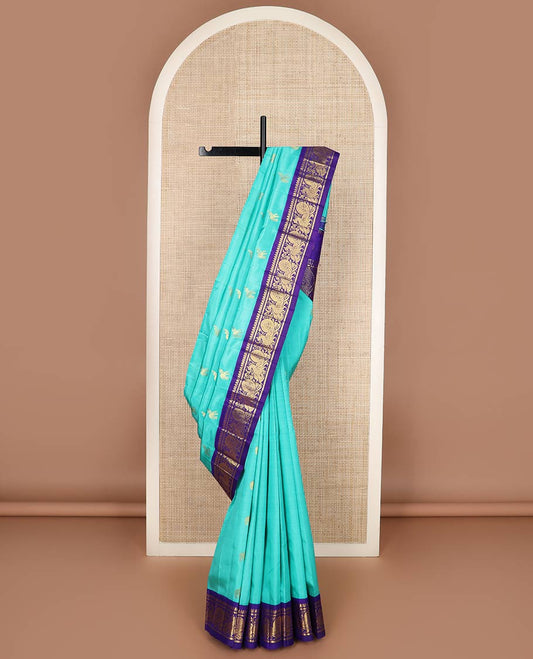 Blue fauna motifs silk saree, contrast one-sided korvai border of thilakam mokku, banaras & mayil designs & pallu steeped with mayil designs