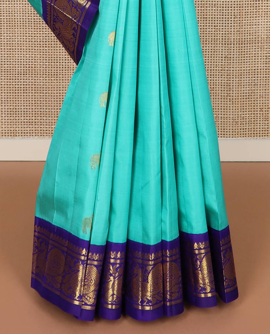 Blue fauna motifs silk saree, contrast one-sided korvai border of thilakam mokku, banaras & mayil designs & pallu steeped with mayil designs