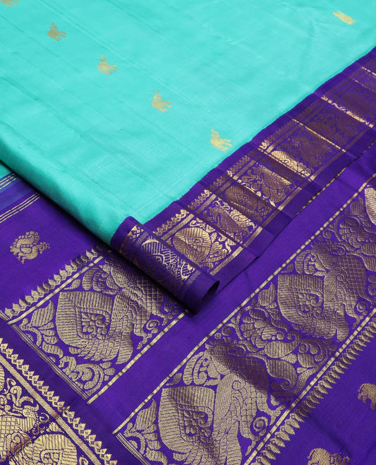 Blue fauna motifs silk saree, contrast one-sided korvai border of thilakam mokku, banaras & mayil designs & pallu steeped with mayil designs