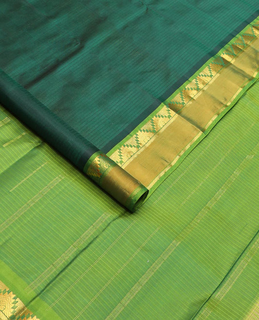 Green striped Kanchipuram silk saree, contrast rettai pettu border of thazampoo rekku, and kathir designs, and zari striped pallu