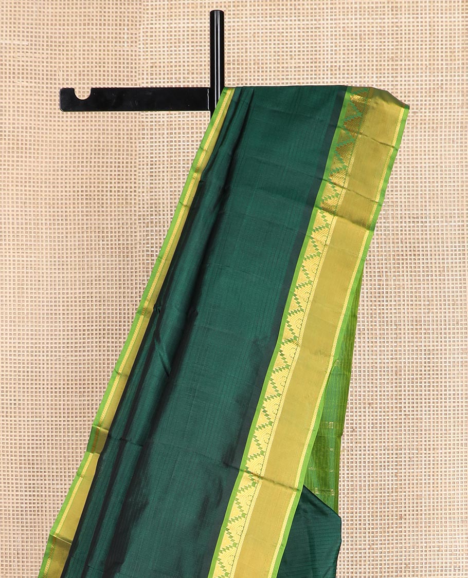Green striped Kanchipuram silk saree, contrast rettai pettu border of thazampoo rekku, and kathir designs, and zari striped pallu