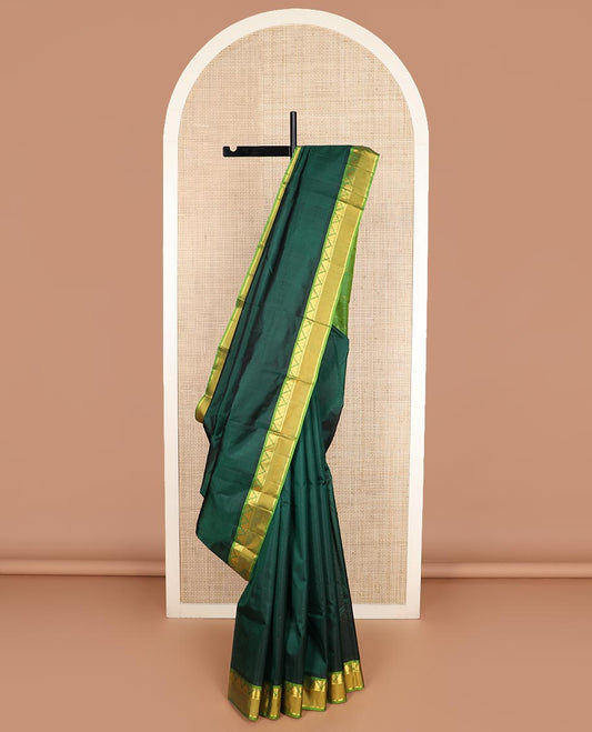 Green striped Kanchipuram silk saree, contrast rettai pettu border of thazampoo rekku, and kathir designs, and zari striped pallu