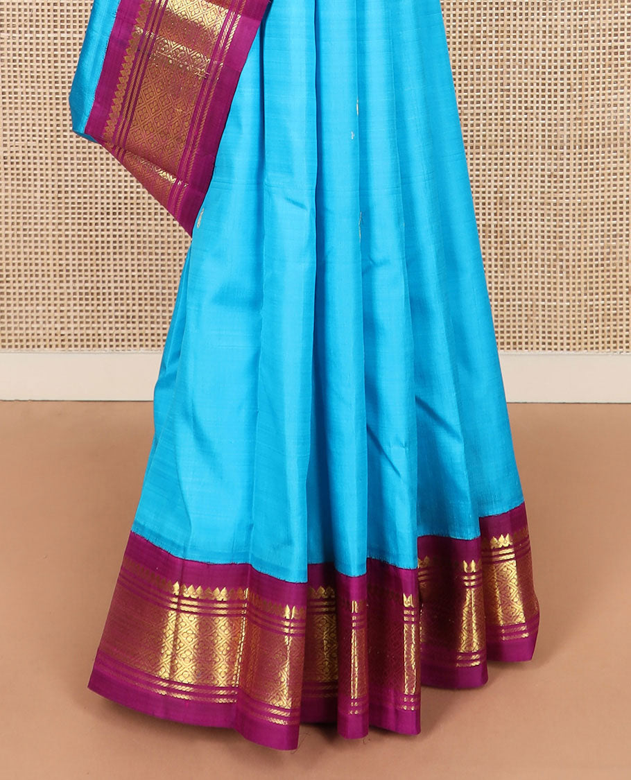 Blue zari buttas Kanchipuram silk saree, contrast korvai border of thilakam mokku, banaras, and jaal designs, and zari design pallu