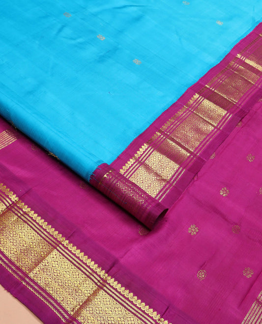 Blue zari buttas Kanchipuram silk saree, contrast korvai border of thilakam mokku, banaras, and jaal designs, and zari design pallu