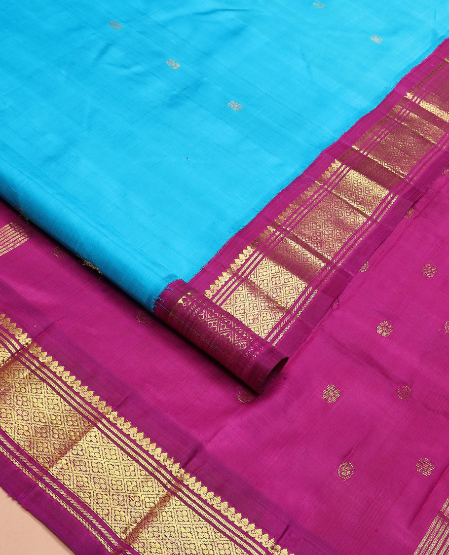 Blue zari buttas Kanchipuram silk saree, contrast korvai border of thilakam mokku, banaras, and jaal designs, and zari design pallu
