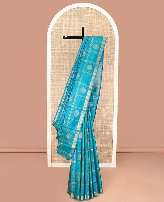 Blue Kanchipuram Silk Saree, Enriched with Zari Butta Enclosed Checked Design All Over Its Body, Subtly Zari-Woven Border, Grand Jaal Design Pallu, and Paired with a Matching Blouse