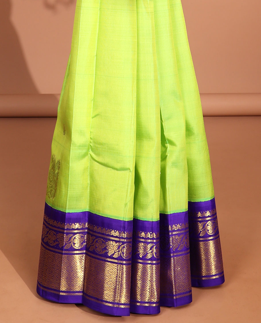 Green floral buttas kancheepuram silk saree with contrast intricate zari border & floral, human design pallu
