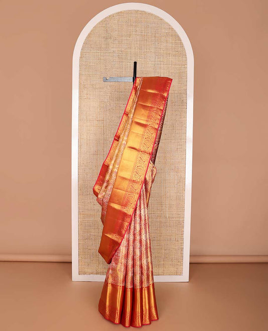 Orange floral design kancheepuram silk saree with contrast border of thilakam mokku, banaras design & zari design pallu