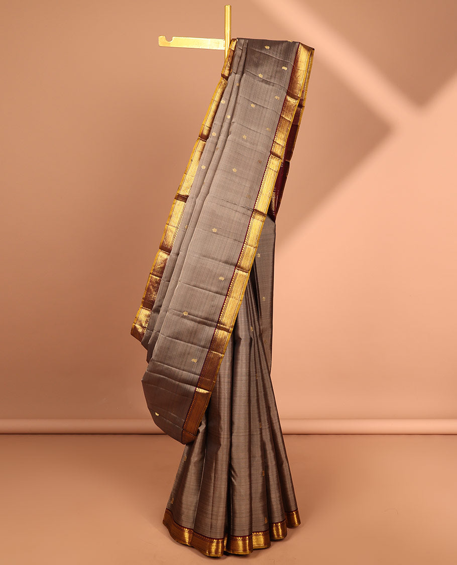 Grey floral buttas kancheepuram silk saree with contrast border of thilakam mokku, muthu, banaras design & zari design pallu