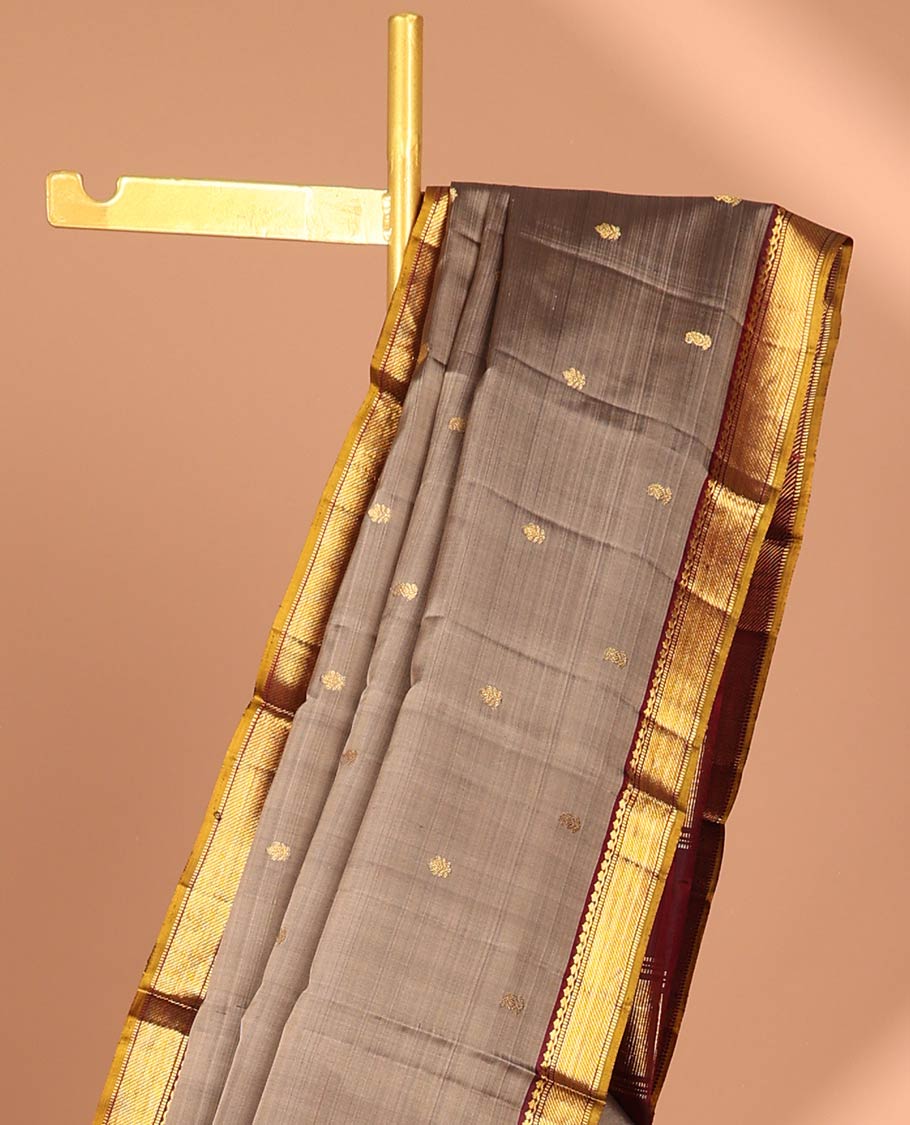 Grey floral buttas kancheepuram silk saree with contrast border of thilakam mokku, muthu, banaras design & zari design pallu