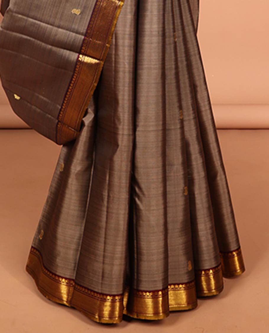 Grey floral buttas kancheepuram silk saree with contrast border of thilakam mokku, muthu, banaras design & zari design pallu