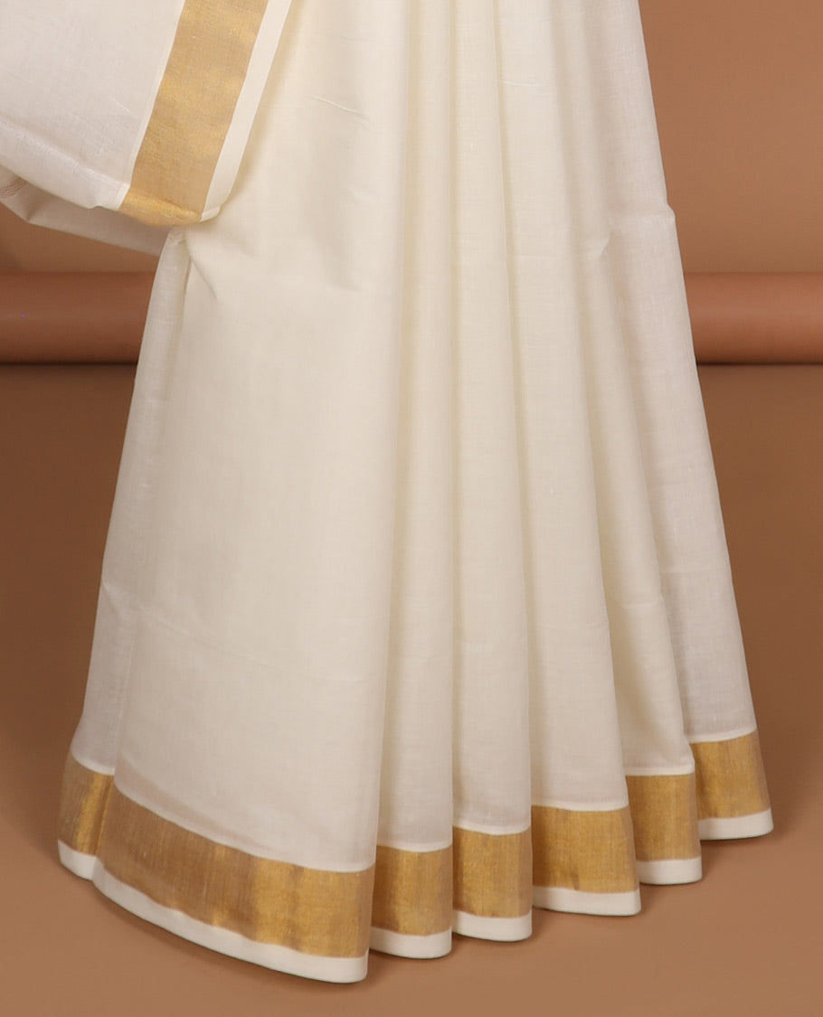 Cream kerala saree with zari stripes, plain border & pallu of floral & peacock designs