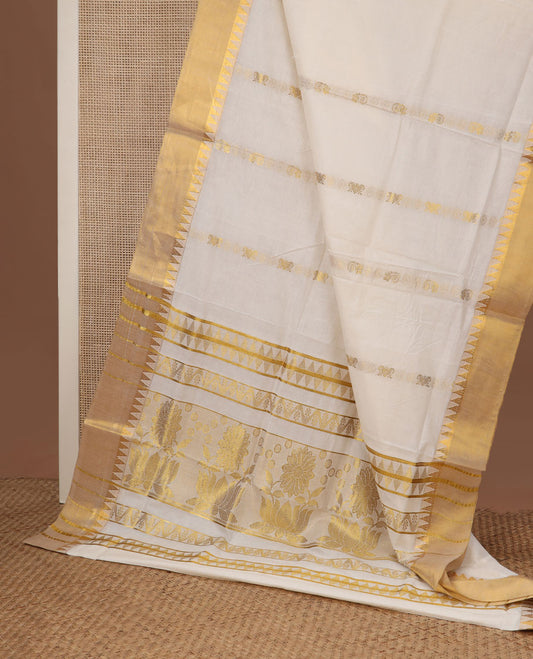 Cream zari design Kerala saree, zari temple border, and pallu features temple and floral designs