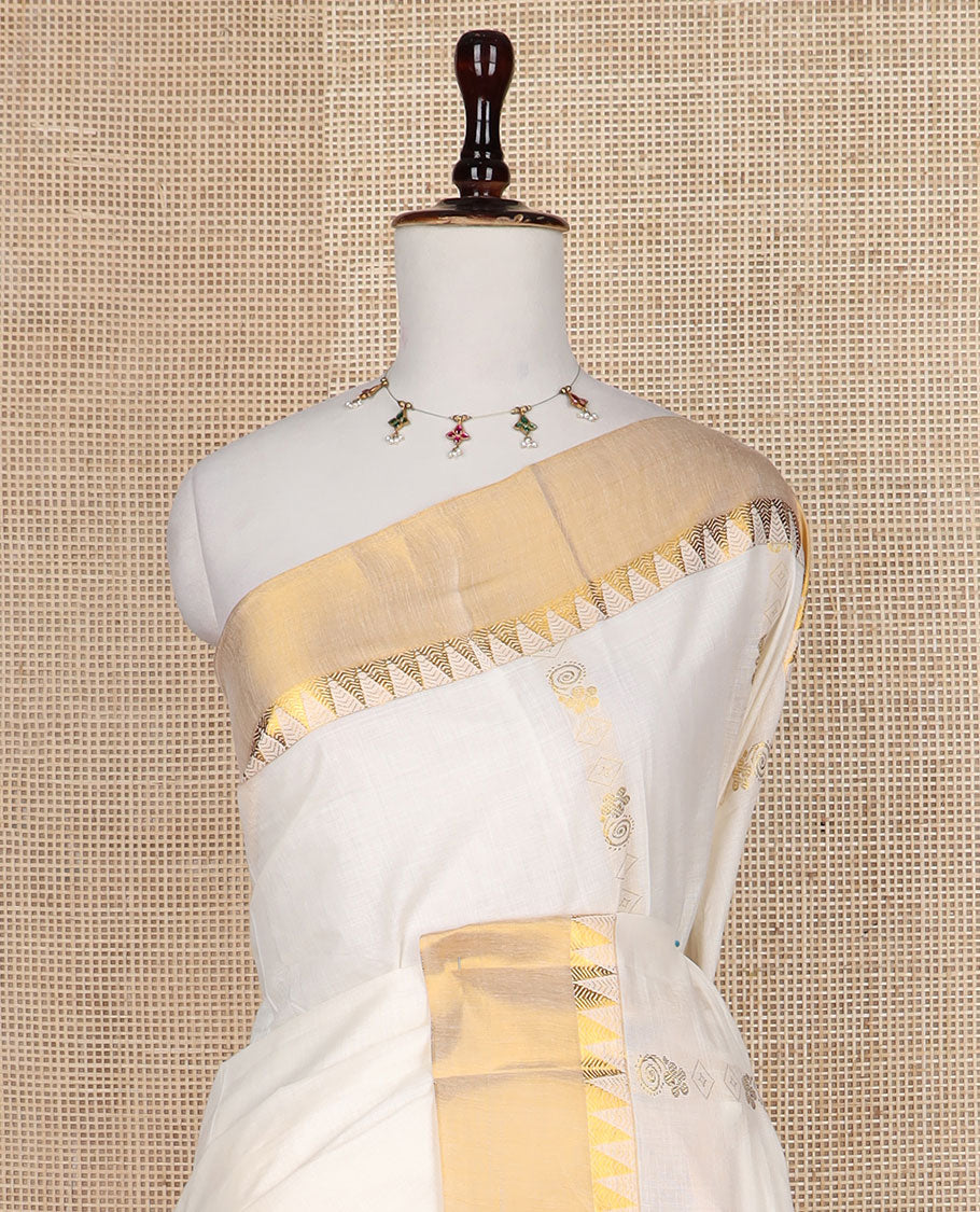 Cream zari design Kerala saree, zari temple border, and pallu features temple and floral designs