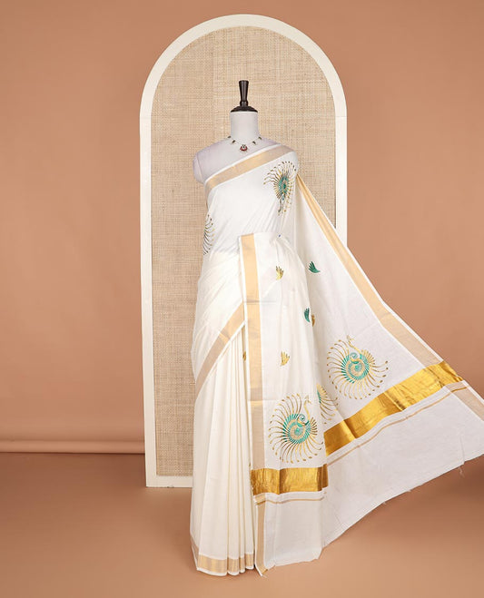Cream peacock motifs embroidered Kerala cotton saree, bavanji border, and peacock embroidered pallu