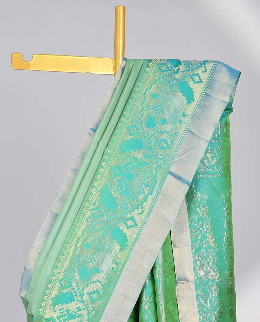 Green floral buttas soft silk saee with contrast ikkat zari border & floral zari design pallu