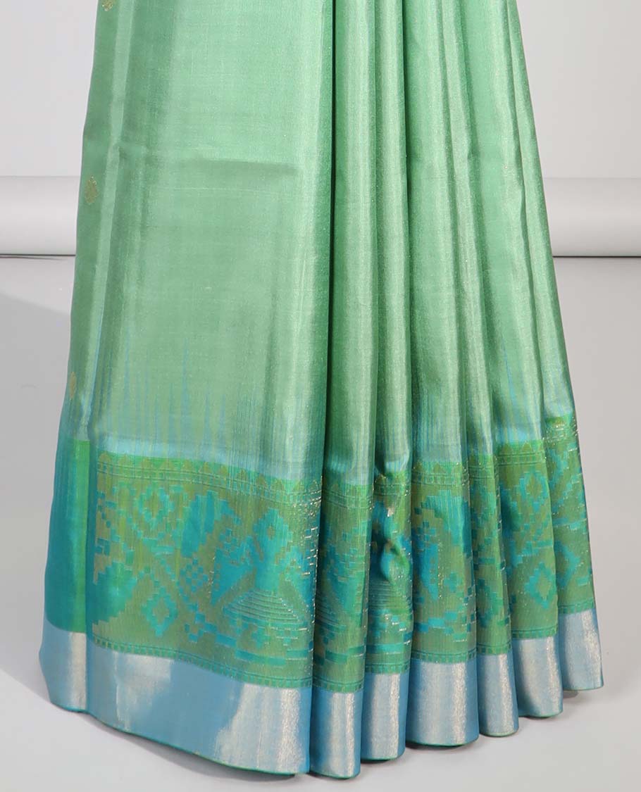 Green floral buttas soft silk saee with contrast ikkat zari border & floral zari design pallu