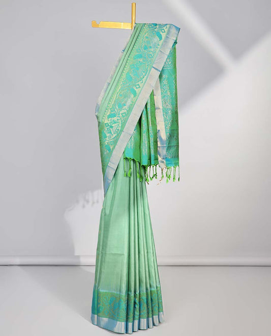 Green floral buttas soft silk saee with contrast ikkat zari border & floral zari design pallu