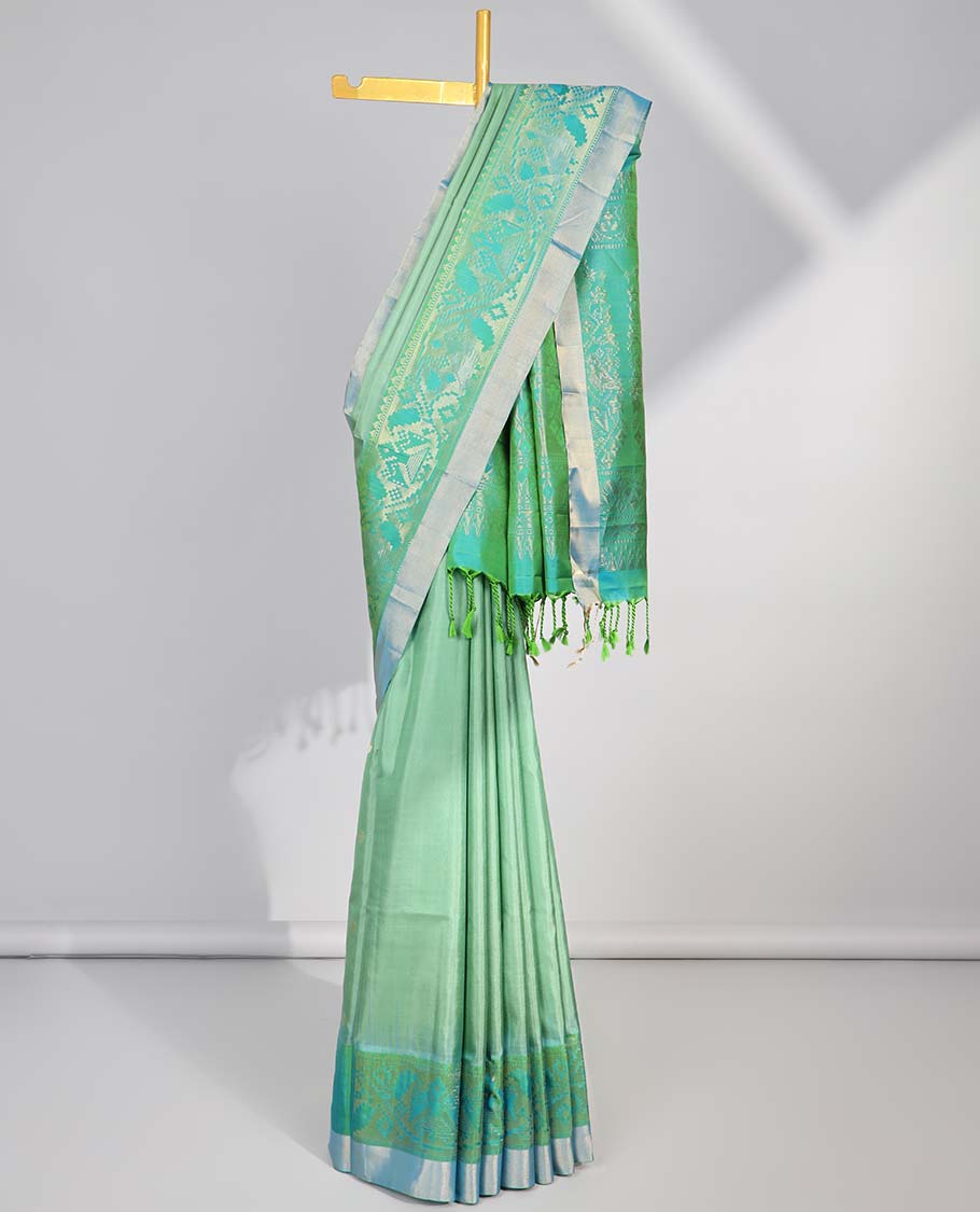 Green floral buttas soft silk saee with contrast ikkat zari border & floral zari design pallu