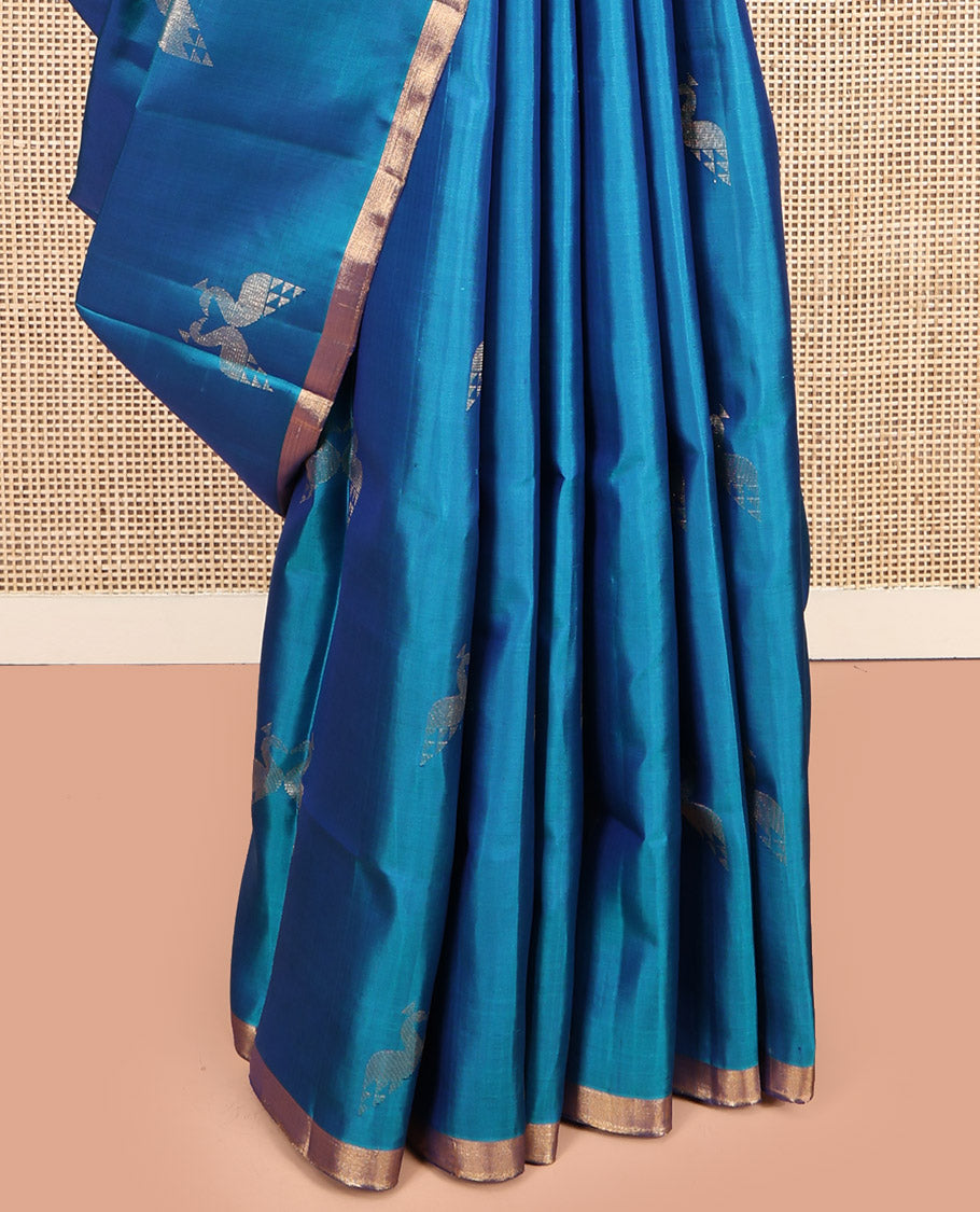 Blue Mayuri Soft Silk Saree, Steeped in the Richness of Mayil Buttas, a Piping Border, Pallu of Ara Maadam Designs, and a Matching Blouse