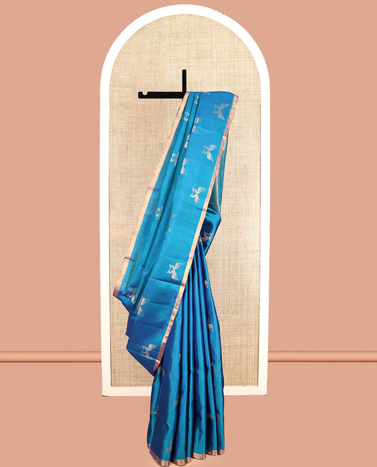 Blue Mayuri Soft Silk Saree, Steeped in the Richness of Mayil Buttas, a Piping Border, Pallu of Ara Maadam Designs, and a Matching Blouse