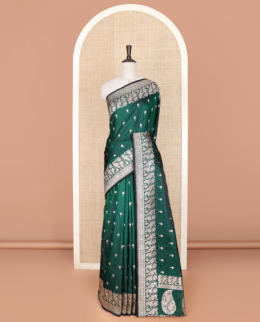 Green buttas mushru silk saree, self-border of floral-paisley creeper designs, and paisley design pallu