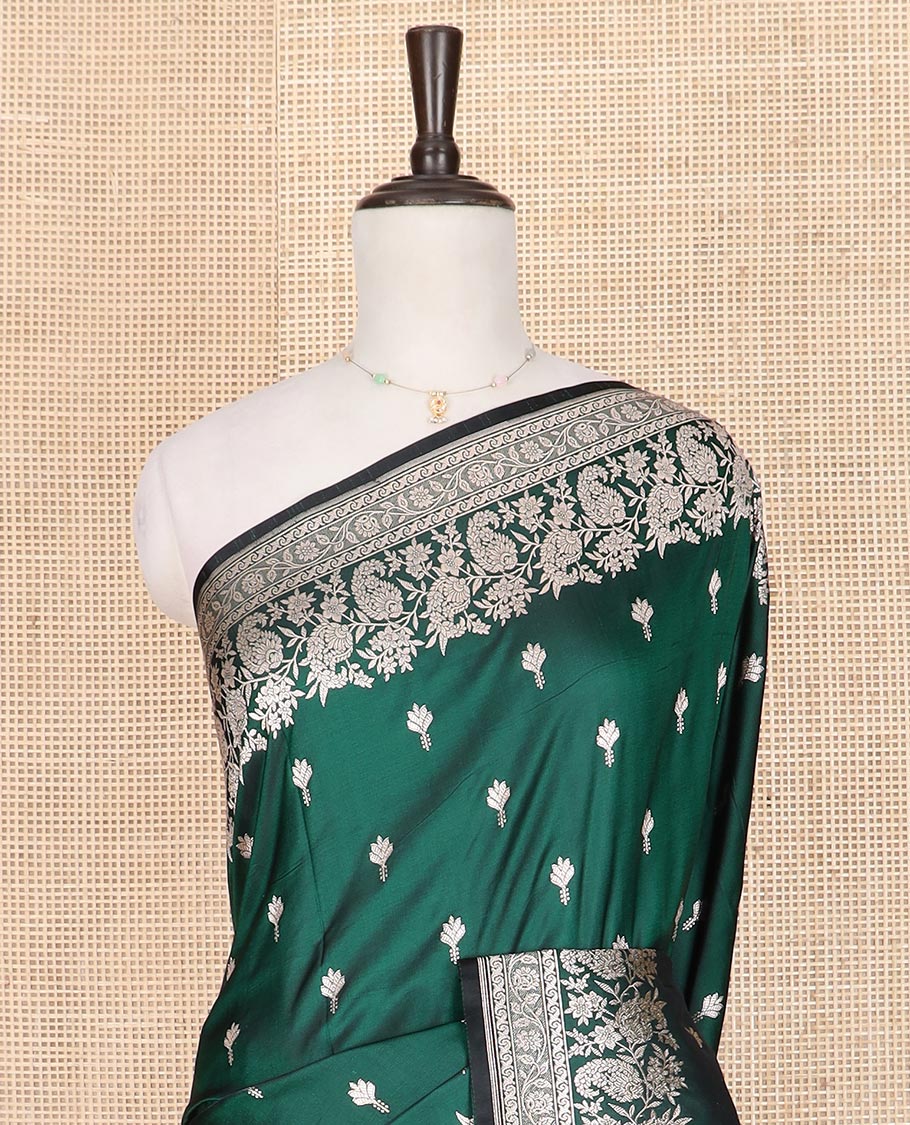 Green buttas mushru silk saree, self-border of floral-paisley creeper designs, and paisley design pallu