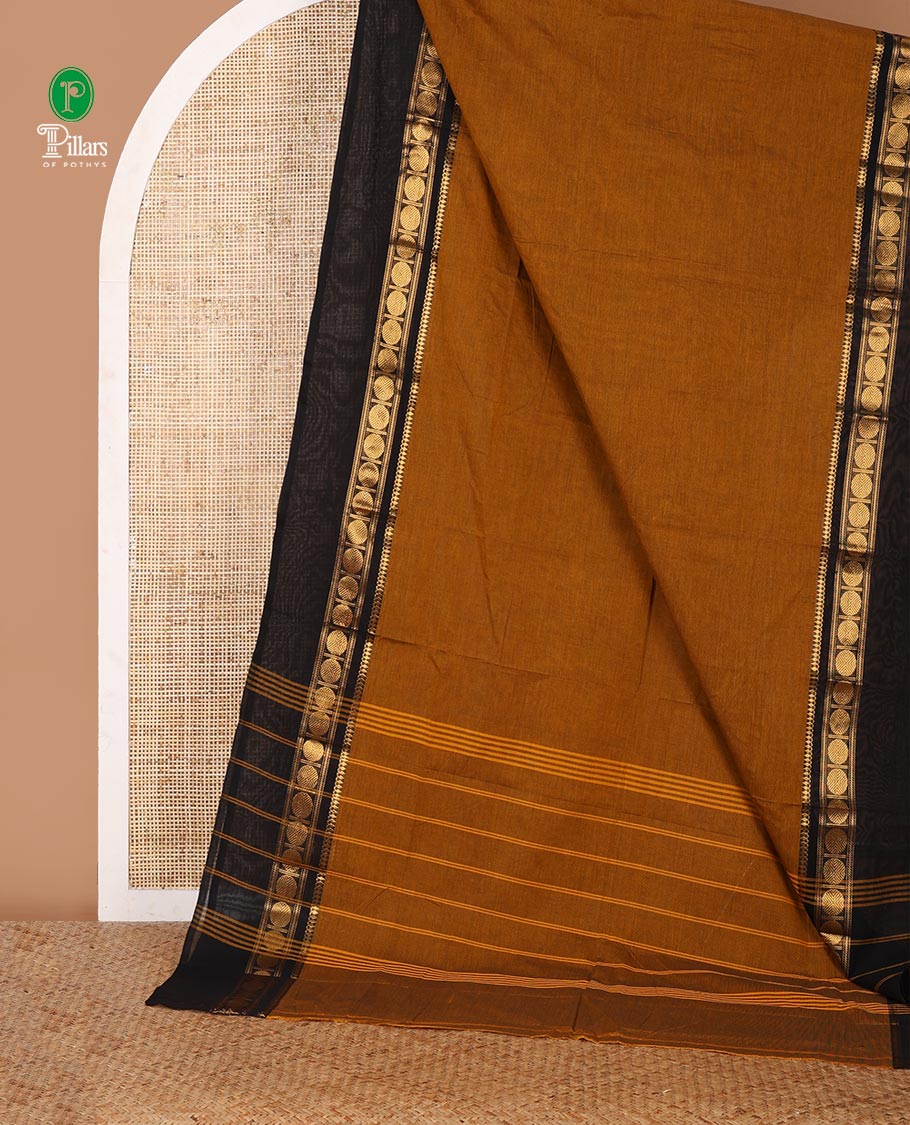 Mustard yellow plain Chettinad cotton saree, contrast zari traditional border of thilakam mokku & rudraksham design & striped pallu