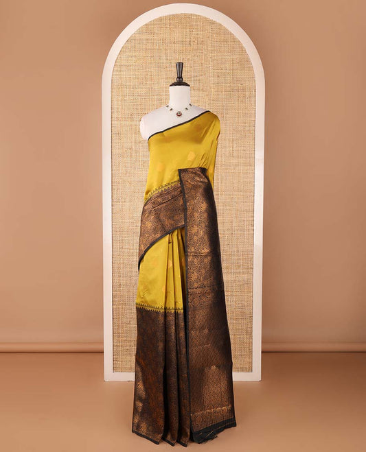Borderless mehendi-black zari buttas & half-&-half vanasingari-style flora-fauna woven kanchi silksaree,self-pallu & blue blouse of zari brocade