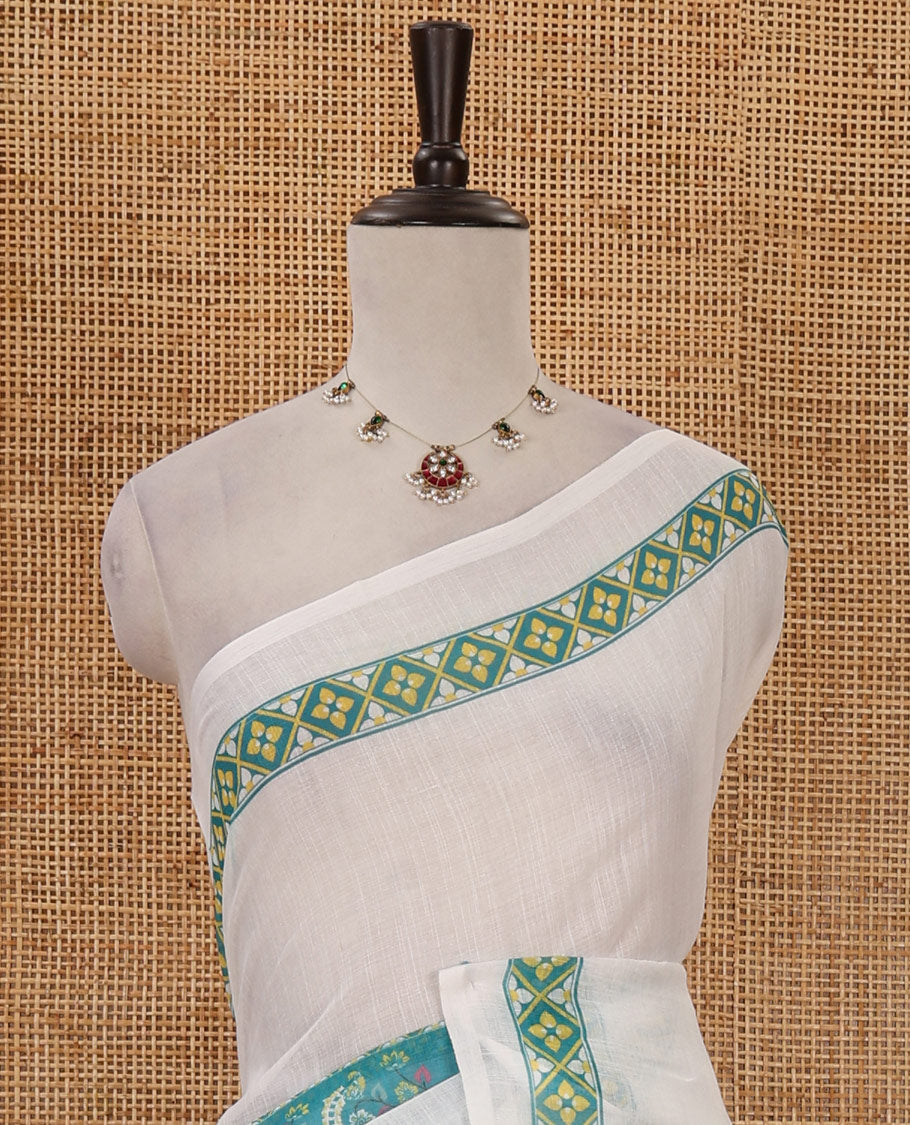 White half-plain & half-printed linen cotton saree, ramar-color diamond-patterned border, kalamkari-style flora-fauna printed pallu & diamond jaal printed blouse