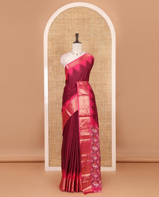 Maroon plain dola-tussar saree, contrast temple zari border, patola animal motifs enclosed jaal printed pallu & patola printed blouse