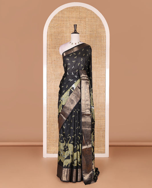 Black-green dargon fly and cranes motifs printed dola silk saree, contrast gold zari border, Mughal floral printed pallu, and dragon fly printed blouse