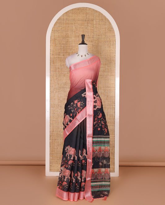 Black 2D style dyed and elephant-floral theme printed linen cotton saree, contrast zari bavanji border, intricately printed pallu, and contrast printed blouse