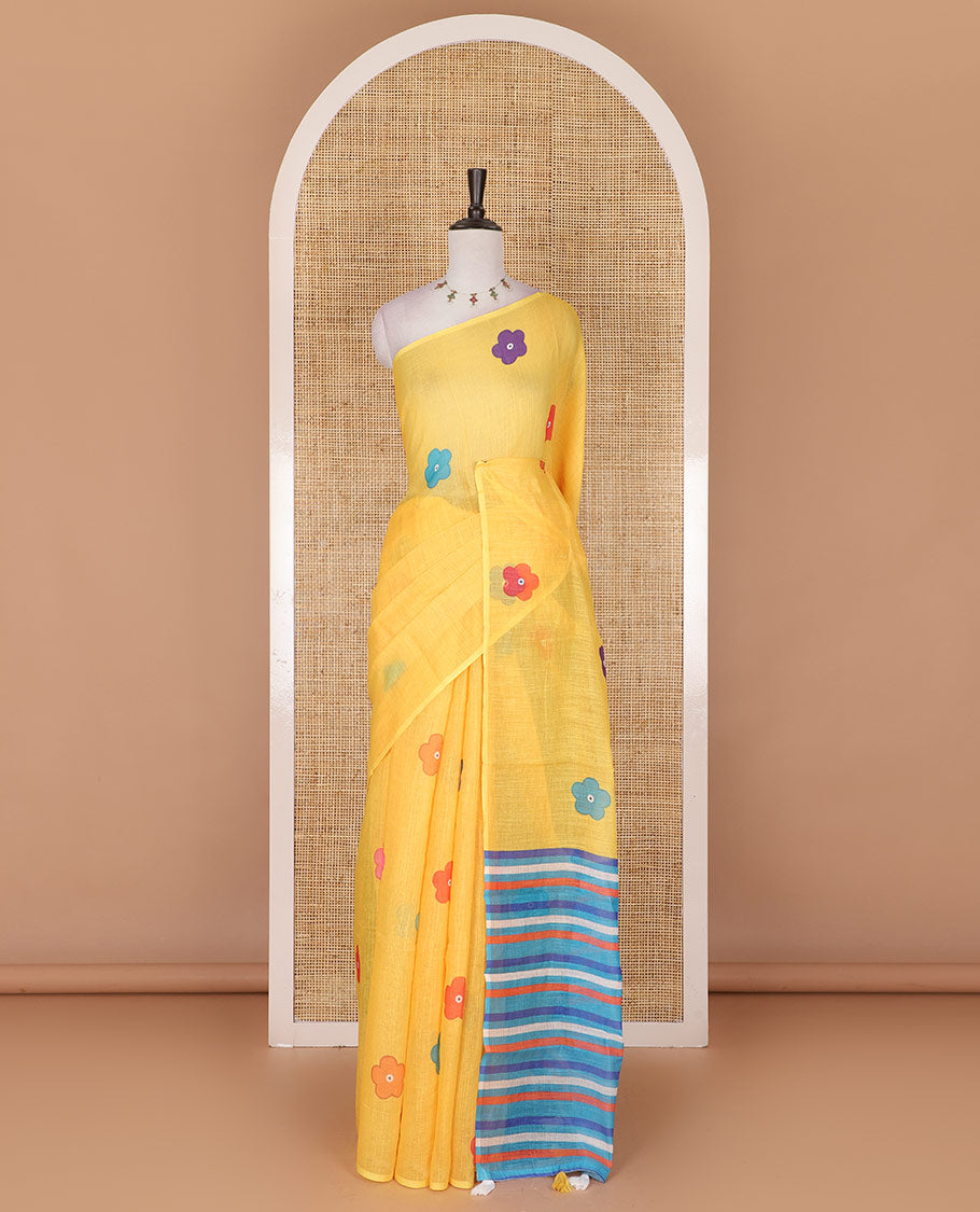 Borderless Yellow colorful five-petal flower motifs printed linen cotton saree, multi-color striped pallu, and contrast printed blouse