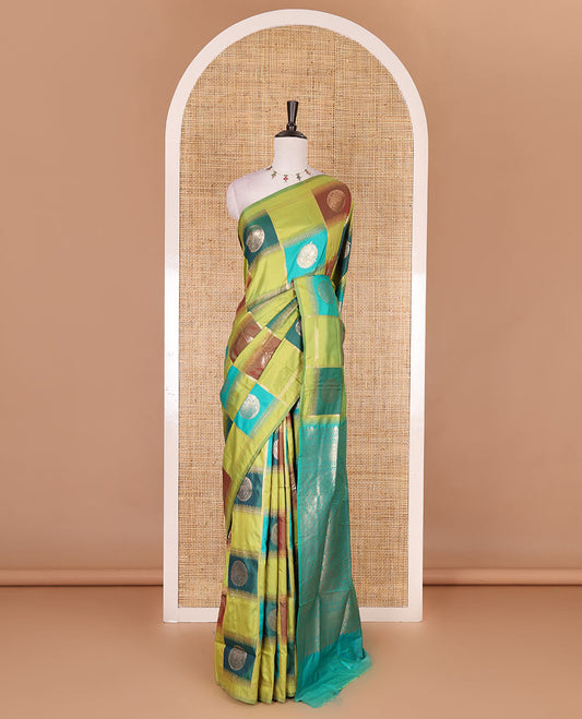 Borderless green chakra buttas enclosed, checked elite soft silk saree, contrast ogee patterned pallu, and contrast zari design blouse