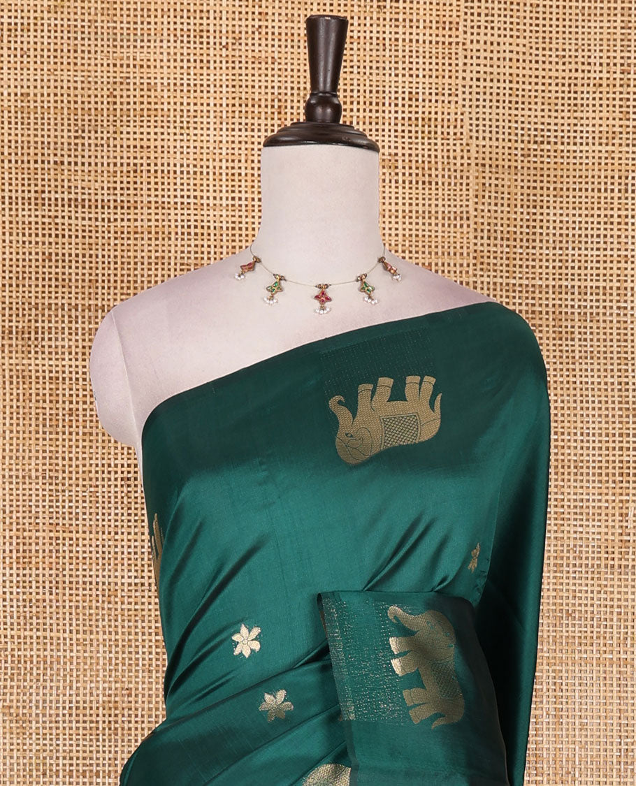 Borderless green floral and elephant buttas zari woven kanchi silk saree, intricate pallu, and matching zari design blouse