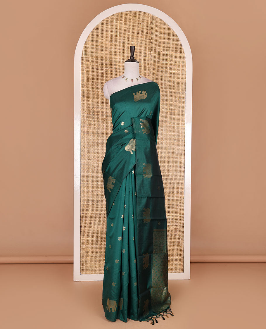 Borderless green floral and elephant buttas zari woven kanchi silk saree, intricate pallu, and matching zari design blouse