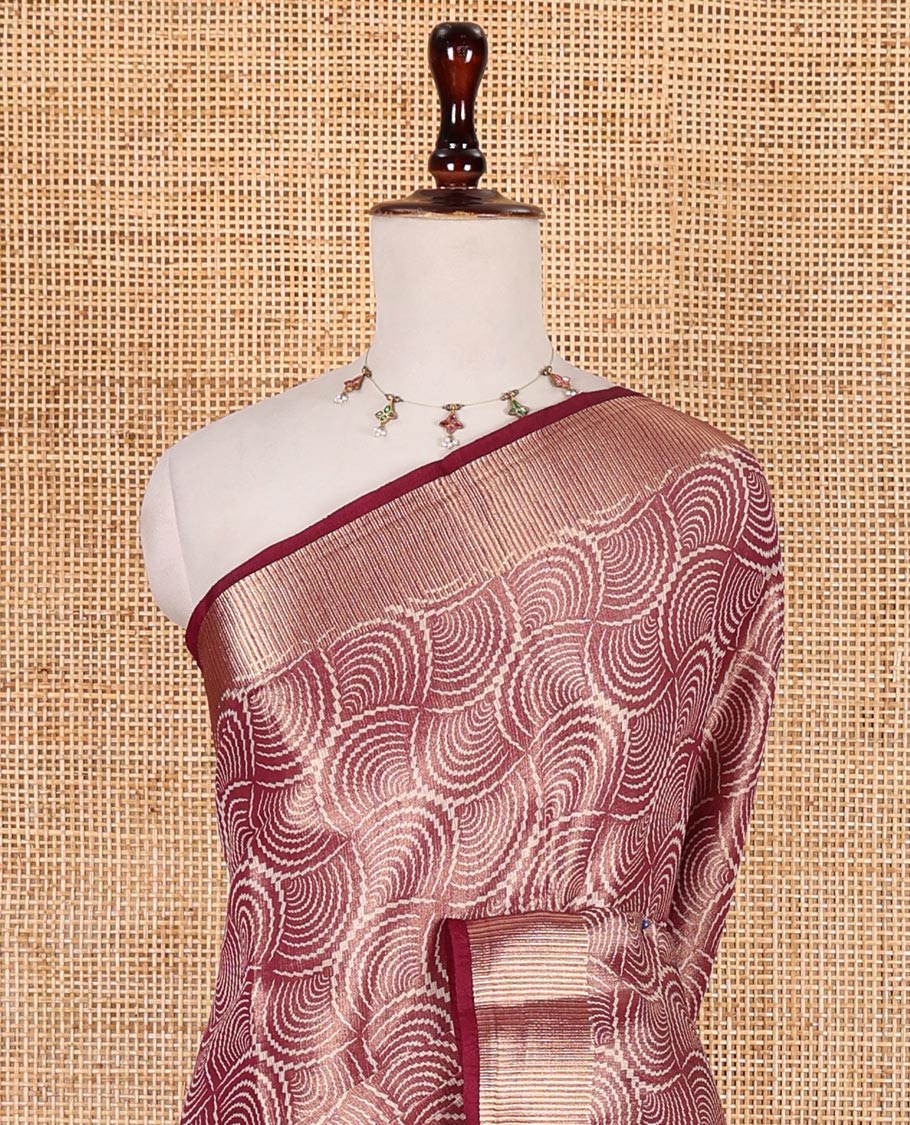 Wine scallop design tissue saree, zari striped border, striped pallu, and gleaming matching blouse
