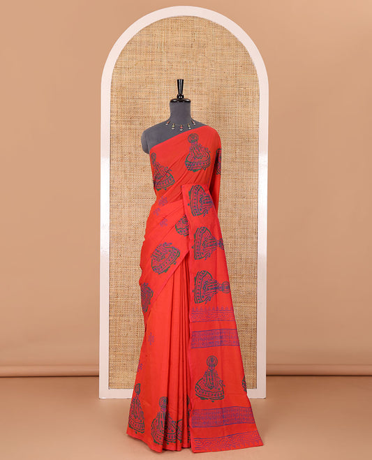 Borderless orange kolam and kathakali motifs printed South cotton saree with a matching blouse, and a contrast floral vine printed blouse