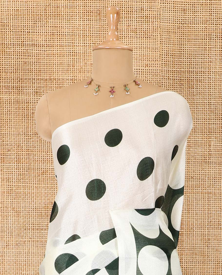 Borderless cream and green polka dots printed art khadi cotton saree, pallu steeped with polka dots, and a contrast tiny polka dots printed blouse