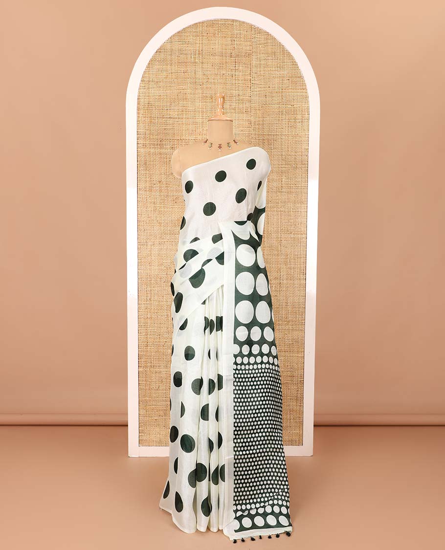 Borderless cream and green polka dots printed art khadi cotton saree, pallu steeped with polka dots, and a contrast tiny polka dots printed blouse